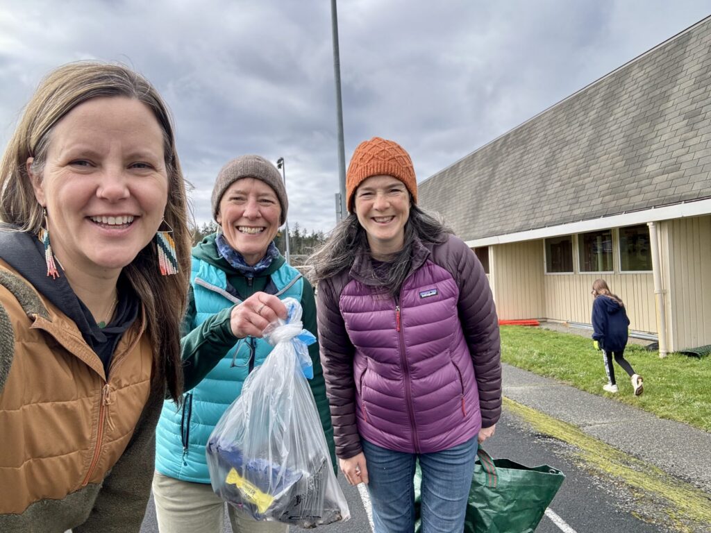 Jess Newley from Friends, Carolyn from Lautenbach Recycling, and Katie Flemming from San Juan County Dept. of Environmental Stewardship are helping clean up school grounds. 