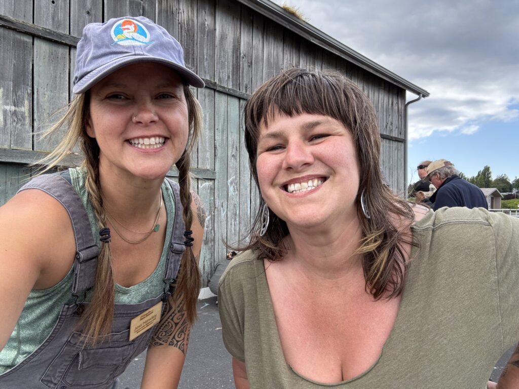 two friends of the san juans volunteers smiling at the camera 