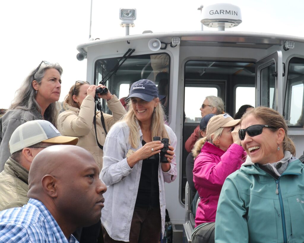 people laughing and smiling on the boat tour