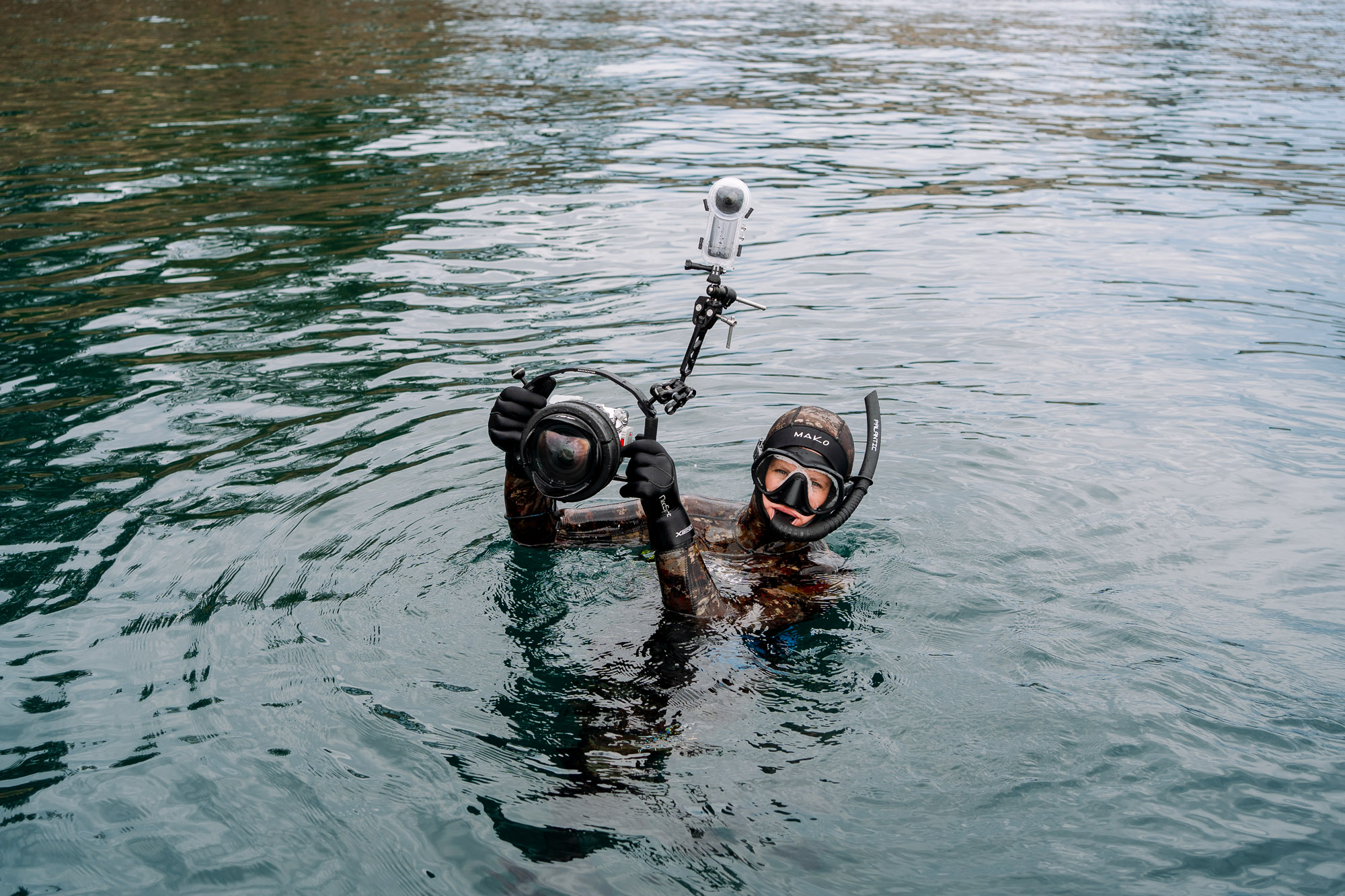 person in diving gear in the ocean