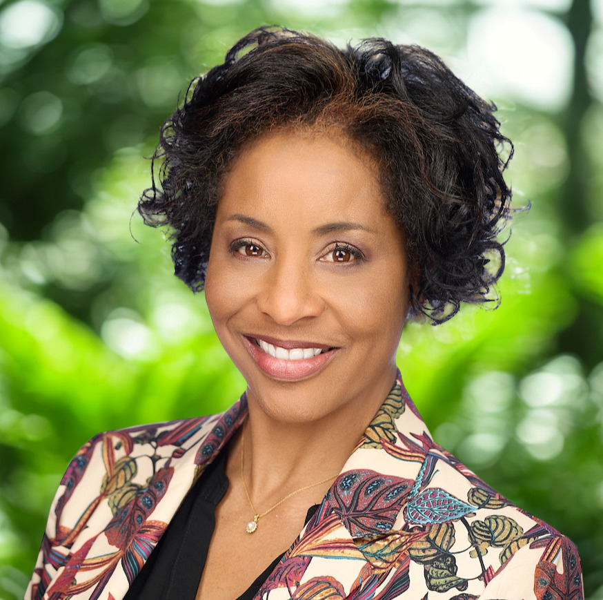 julia yarbough profile picture, wearing a colorful jacket